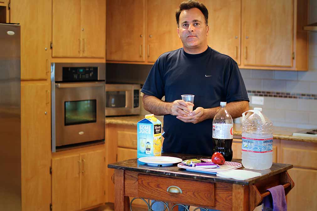 Resident using kitchen at Diamond, a supportive housing community
